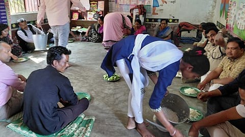 The anganwadi cook Sarmista Sethi serving food at the community feast