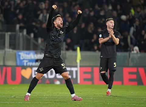 Celebrities Pisa's Felipe Loyola, left, celebrates after scoring against AC Milan.