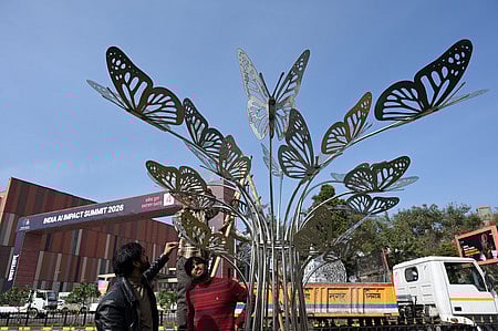 Workers engaged in Beautification work near the Bharat Mandapam in New Delhi on February 13, 2026 ahead of the AI Impact Summit in India.