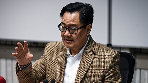 Union Parliamentary Affairs Minister Kiren Rijiju addresses a press conference in New Delhi.