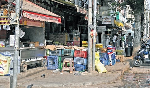 Illegal occupation by hawkers on foothpath in Sindhi Colony