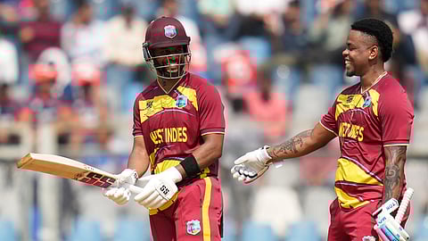 West Indies' Shimron Hetmyer, right congratulates captain Shai Hope for his fifty runs during the T20 World Cup cricket match between Nepal and West Indies in Mumbai, India, Sunday, Feb. 15, 2026.