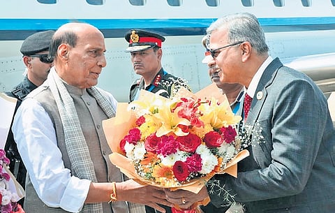 Defence Minister Rajnath Singh being welcomed by officers at the HAL Airport in Bengaluru on Monday