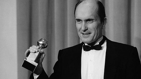 Actor Robert Duvall holds the Golden Globe award he won for best actor in a dramatic motion picture for his role in "Tender Mercies" in Beverly Hills, Calif., on Jan. 29,198 4.