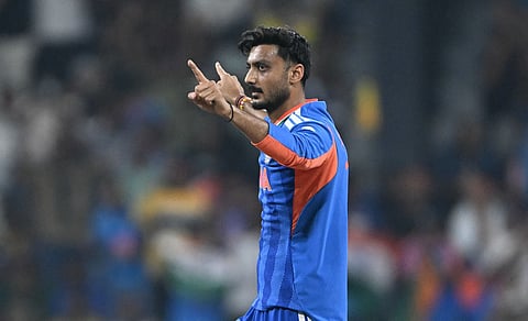 Axar Patel celebrates after taking the wicket of Pakistan's Babar Azam on Sunday