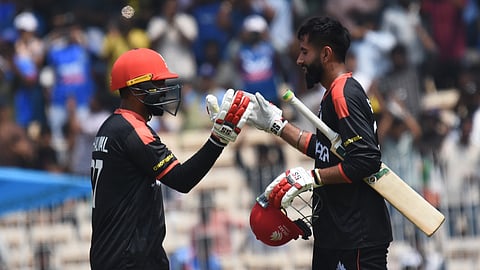 Canada team batsman yuvaraj Samra plays celebrates his century against Newzealand at the T20 world cup match at MAC in chennai.