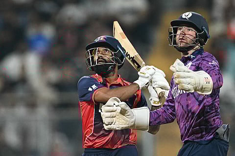 Nepal's Dipendra Singh Airee (L) plays a shot during the 2026 ICC Men's T20 Cricket World Cup group stage match between Nepal and Scotland at the Wankhede Stadium in Mumbai.