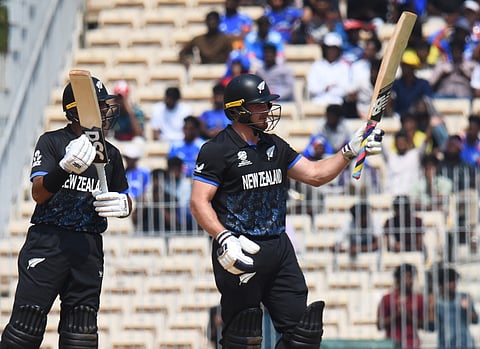 Glenn Phillips (R) celebrates his half century with (L) Rachin Ravindra on Tuesday