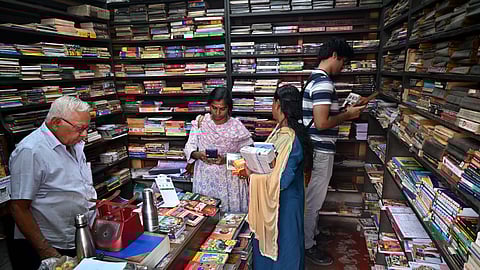 GR Jyothiprakash Gupta (left) at Gupta Circulating Library in Malleswaram