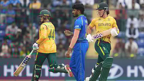 South Africa's Dewald Brevis, right, and Ryan Rickelton run between the wickets to score during the T20 World Cup cricket match between South Africa and United Arab Emirates in New Delhi, India, Wednesday, Feb. 18, 2026.