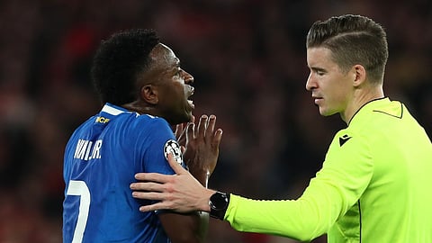 Real Madrid's Vinicius Junior argues with referee François Letexier after scoring the opening goal during a Champions League playoff soccer match between SL Benfica and Real Madrid in Lisbon, Portugal, Tuesday, Feb. 17, 2026.