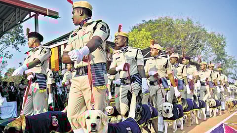 Canine recruits march with handlers during the passing-out parade of the 25th batch at IITA, Moinabad.