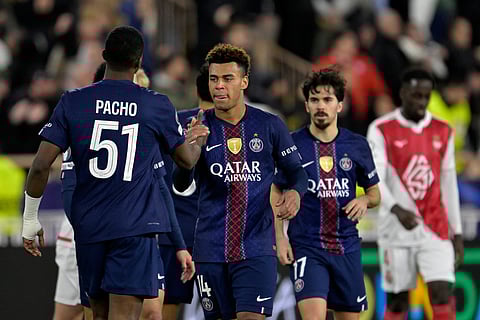 PSG players celebrate at the end of the first-leg of the Champions League playoff soccer match between Monaco and Paris Saint-Germain in Monaco, Tuesday, Feb. 17, 2026.