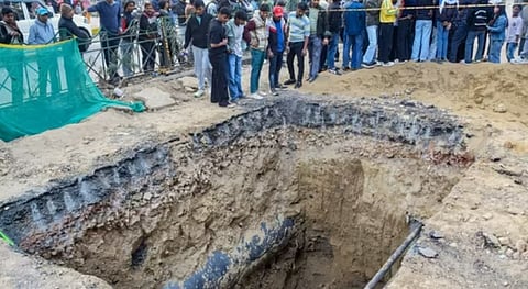 The unbarricaded section of the road dug up by the Delhi Jal Board where the accident occurred.