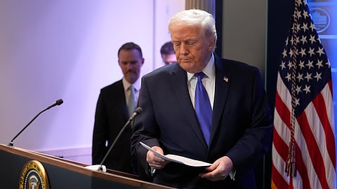 US President Donald Trump walks up to the podium to speak with reporters in the James Brady Press Briefing Room at the White House, Friday, Feb. 20, 2026, in Washington.