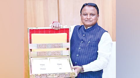 CM Mohan Charan Majhi showcasing the Budget document before placing it in the Assembly