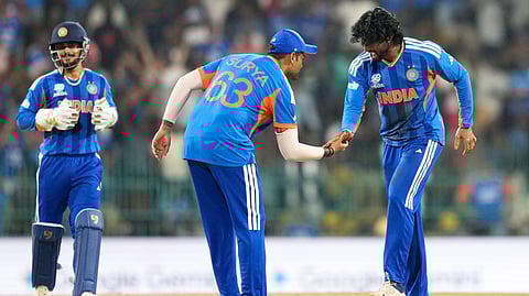 India's Tilak Varma, right, and captain Suryakumar Yadav celebrate the wicket of Pakistan's Shadab Khan during the T20 World Cup cricket match between India and Pakistan in Colombo, Sri Lanka, Sunday, Feb. 15, 2026.