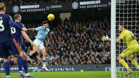 Manchester City's Nico O'Reilly scores during the English Premier League soccer match between Manchetser City nad Newcastle in Manchester, England, Saturday, Feb. 21, 2026.
