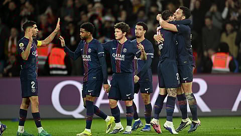 PSG's Goncalo Ramos, right, celebrates with teammates after scoring his side's third goal during the French League One soccer match between Paris Saint-Germain and Metz in Paris, France, Saturday, Feb. 21, 2026.