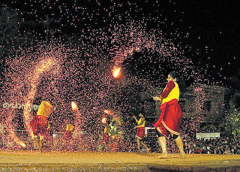 Performers at Ponniyathankam, the traditional martial arts festival of Kannur