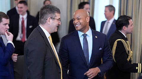 Gov. Wes Moore, D-Md., right, attends a breakfast with the National Governors Association in the State Dining Room of the White House, Friday, Feb. 20, 2026, in Washington.