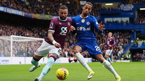Burnley's Kyle Walker, left, and Chelsea's Joao Pedro battle for the ball during their English Premier League soccer match in Birmingham, England, Saturday, Feb. 21, 2026.