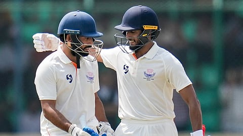 Jammu and Kashmir's Shubham Pundir, left, and Yawer Hassan during the first day of the Ranji Trophy 2025-26 final cricket match between Karnataka and Jammu & Kashmir, at KSCA Cricket Stadium in Hubballi.