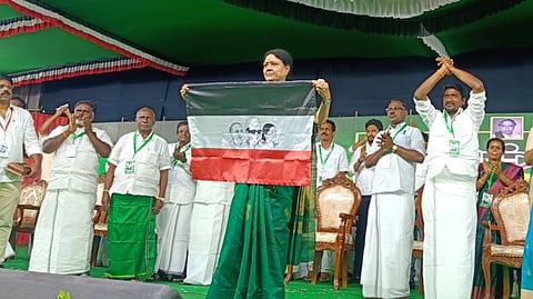 VK Sasikala unveils her new party flag during a public meeting held in Ramanathapuram district.