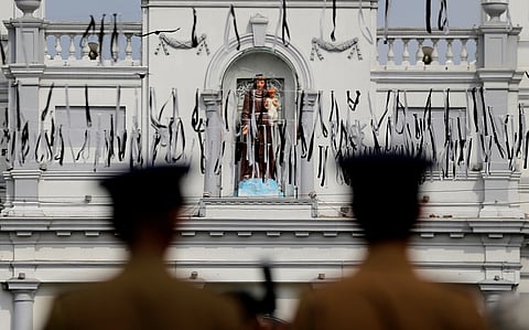 Sri Lankan police officers secure the area of the exploded St. Anthony's Church on Easter Sunday attacks in Colombo, Sri Lanka, April 28, 2019.