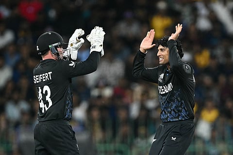 New Zealand's Rachin Ravindra (R) celebrates with wicketkeeper Tim Seifert (L) after taking the wicket of Sri Lanka's Kusal Mendis during the 2026 T20 World Cup Super Eights match between Sri Lanka and New Zealand in Colombo.