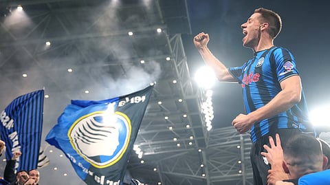 Atalanta's Mario Pasalic celebrates after scoring their third goal during the Champions League second leg playoff match between Atalanta and Borussia Dortmund in Bergamo, Italy, Wednesday, Feb. 25, 2026.