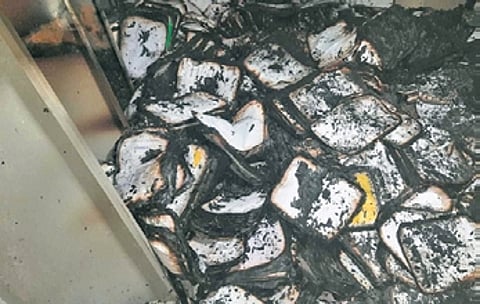 The charred remains of the documents which were gutted at Lokayukta office record room on Thursday | Express