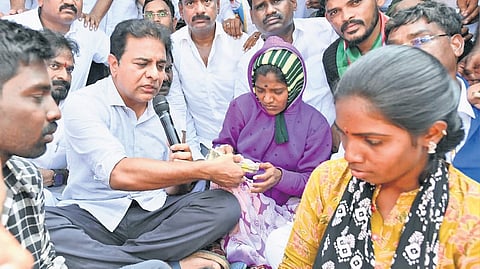 BRS working president
KT Rama Rao with the woman who lost her infant during a clash at a jatara in Kummera in Nagarkurnool district.