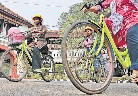 Students and teachers of Government Women’s College, Thiruvananthapuram, ride bicycles on the campus on Friday as part of the bicycle literacy campaign