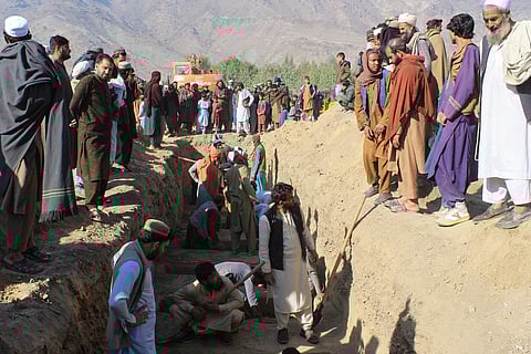 People attend the funeral of victims of a series of cross-border Pakistani army strikes that Pakistan said targeted hideouts of militants it blames for recent attacks inside the country, in the Behsud district of Nangarhar province, Afghanistan.