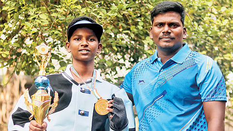 Perarivaalan stands next to his coach, James Raja, with his prize after bagging the first place in SGADF National Games held in Karaikal in December 2025