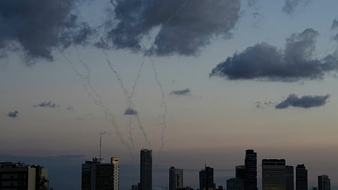 Traces of an air defense missile interception is seen over Tel Aviv, Israel, Saturday, Feb. 28, 2026.