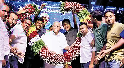 Former CM BS Yediyurappa being felicitated by his fans in Shikarupura on Friday.
His sons BY Raghavendra and BY Vijayendra look on