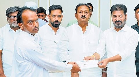 Chief Minister A Revanth Reddy hands over ex gratia cheques to kin of victim’s of the Madinah bus accident, at the Secretariat in Hyderabad on Saturday