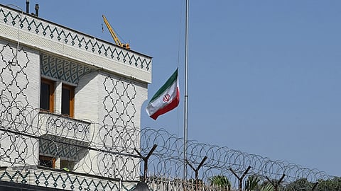 The Iranian national flag flies at half-mast at the Iranian Embassy following the killing of Iran's Supreme Leader Ayatollah Ali Khamenei.