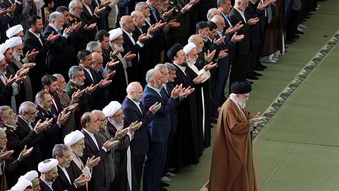 In this photo released by the official website of the office of the Iranian supreme leader, Supreme Leader Ayatollah Ali Khamenei leads an Eid al-Fitr prayer marking the end of the Muslim holy fasting month of Ramadan at the Imam Khomeini Grand Mosque in Tehran, Iran, Monday, March 31, 2025.