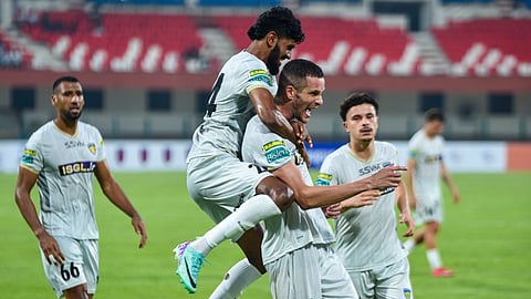 Chennaiyin FC defender Elsinho (C) celebrates his goal on Sunday