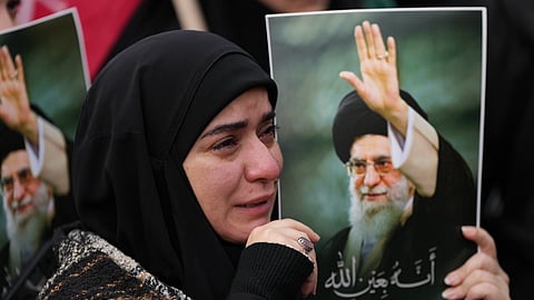 A woman cries as she mourns the death of Iranian Supreme Leader Ayatollah Ali Khamenei, during a gathering in the southern Suburb of Beirut, Lebanon, Sunday, March 1, 2026.