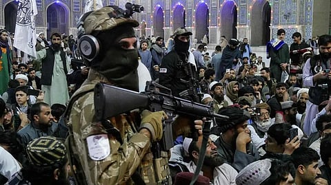Afghan men gather after offering Tarawih prayers during the Islamic holy fasting month of Ramadan at Jami Masjid or the Great Mosque of Herat in Herat on February 28, 2026 to pledge solidarity to the Taliban amid their ongoing conflict with Pakistan.