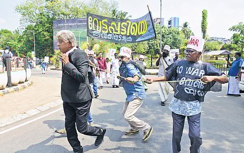 Activists of the Purogamana Kala Sahithya Sangam staging a street play in Kochi against
US-Israel strikes on Iran and killing of Iranian leader Ayatollah Ali Khamenei