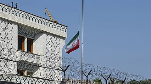 The Iranian national flag flies at half-mast at the Iranian Embassy following the alleged killing of Iran's Supreme Leader Ayatollah Ali Khamenei in a US-Israel strike, in New Delhi, Sunday, Mar. 1, 2026.