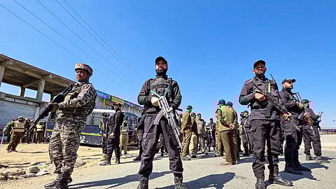 Security personnel stand guard as strict restrictions remained imposed in Kashmir following massive protests across the valley against the killing of Iran's Supreme leader Ayatollah Ali Khamenei in joint air strikes by the US and Israel, in Sopore, Jammu and Kashmir, Tuesday, March 3, 2026.