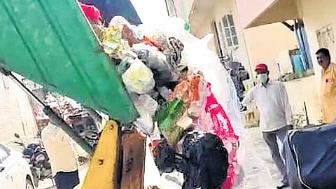 A file picture of garbage being dumped at a resident’s doorstep