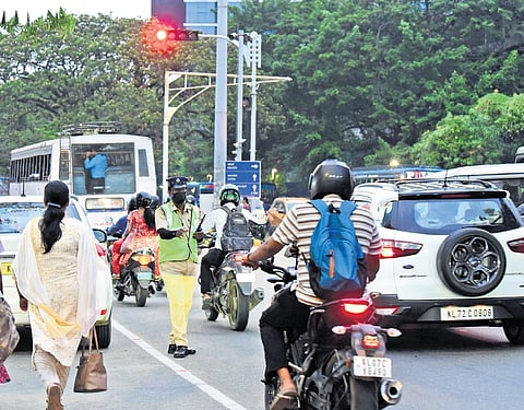 A traffic police personnel managing vehicular movement at High Court Junction as the surveillance camera there is not functioning