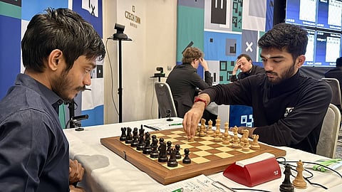 Defending champion Aravindh Chithambaram (L) and D Gukesh during their game at the Prague International Chess Festival.
